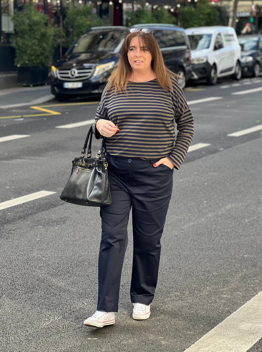 Large navy blue pants worn with a sailor suit