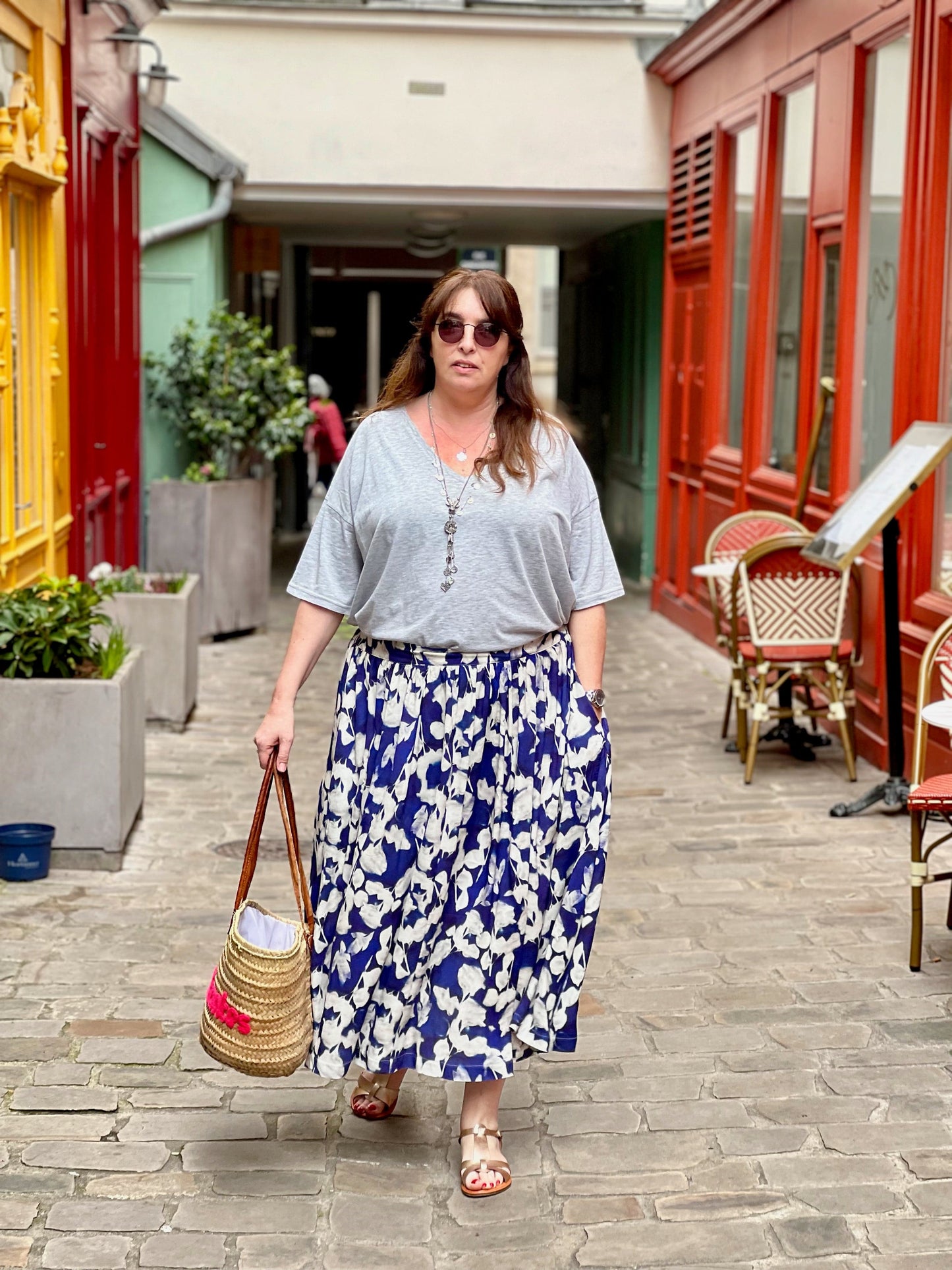 Blue and white printed maxi skirt worn with grey tee shirt